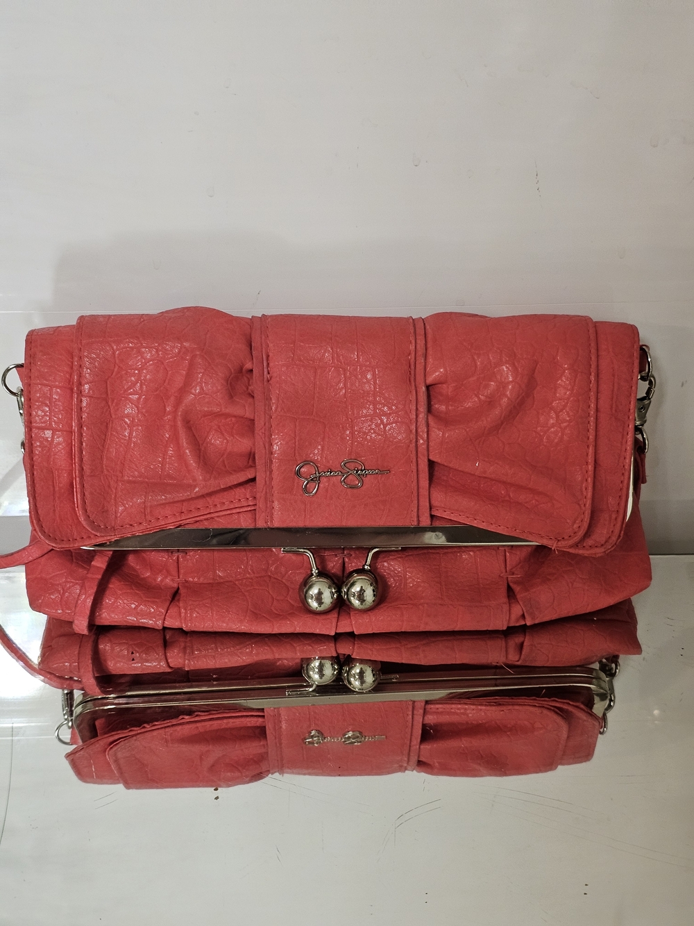Jessica Simpson Coral Pink Fold-Over Clutch with Bow Detail And Strap